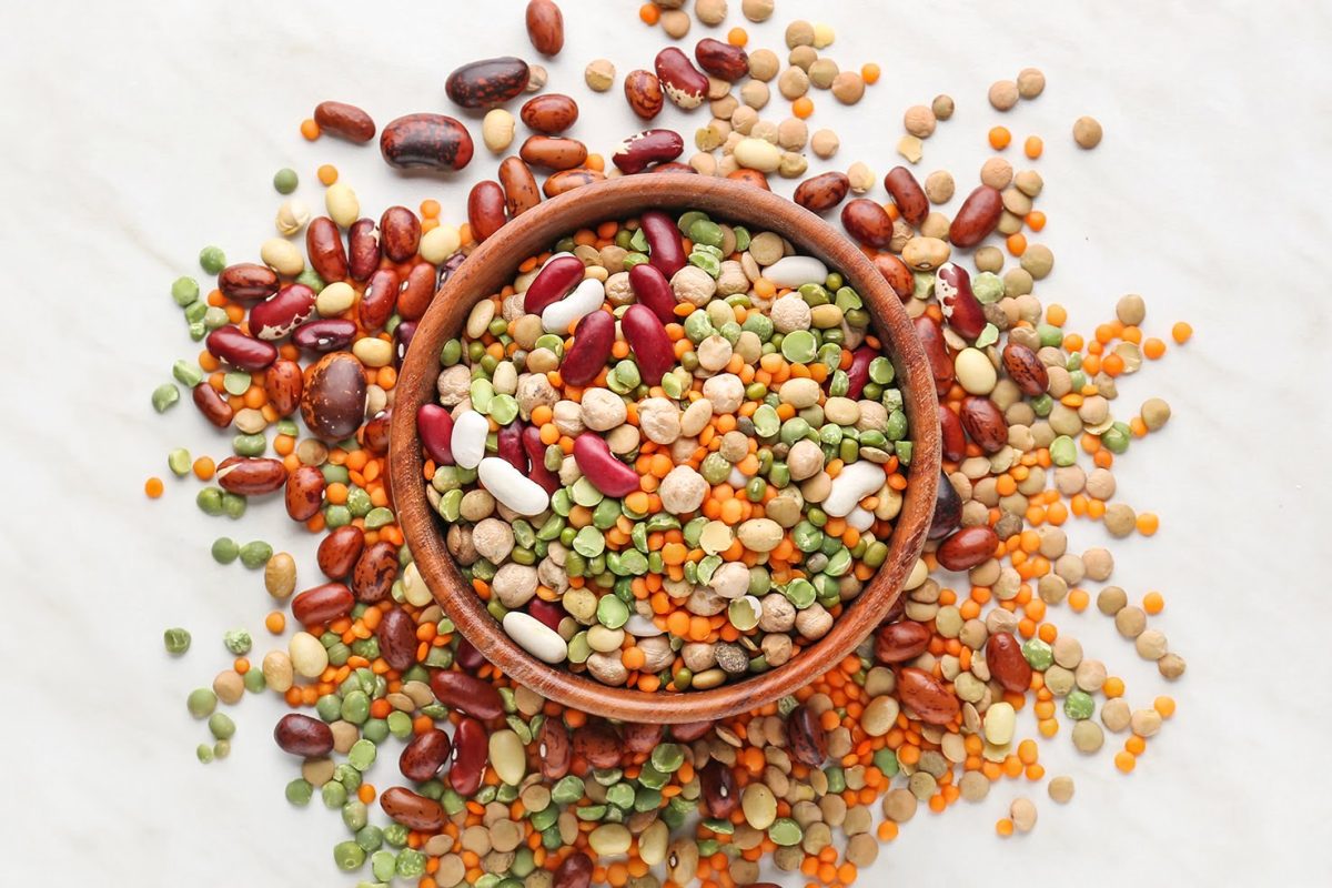 Bowl with different legumes on  table